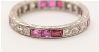 Lot 547 - Ruby and diamond eternity ring