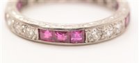 Lot 547 - Ruby and diamond eternity ring