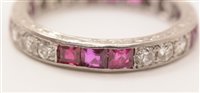 Lot 547 - Ruby and diamond eternity ring