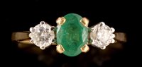 Lot 558 - Diamond and emerald ring
