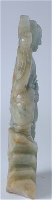 Lot 38 - A 20th Century Chinese carved spinach-green jade figure of a boy.