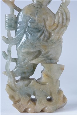 Lot 38 - A 20th Century Chinese carved spinach-green jade figure of a boy.
