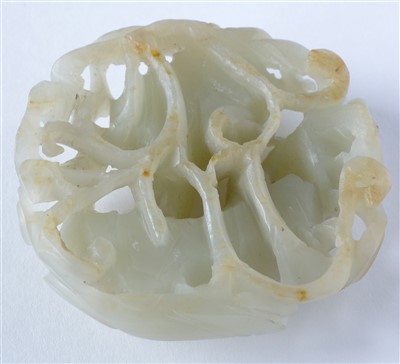 Lot 39 - An early 20th Century Chinese carved pale green jade pendant, and a hardstone disc.