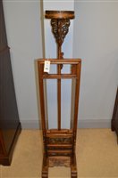 Lot 1197 - A pair of Chinese lamp stands