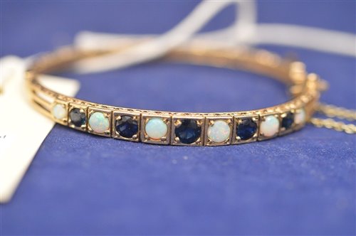 Lot 726 - Sapphire and opal bangle