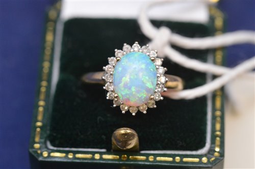 Lot 724 - Opal and diamond ring