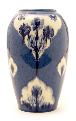 Lot 135 - William Moorcroft: a blue and white 'Florian' ware vase.