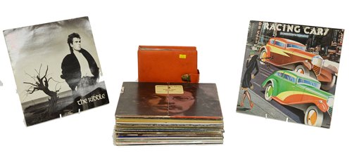 Lot 395 - Approx thirty 12" rock records and a booklet of 7" singles.
