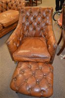 Lot 1086 - leather armchair and stool