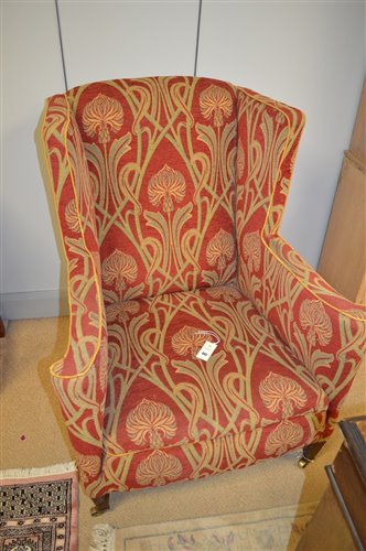 Lot 943 - Wing back armchair