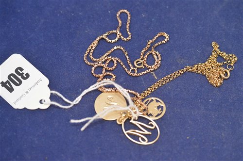 Lot 304 - Gold pendant and yellow metal pendants and chains