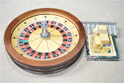 Lot 110 - John Huxley roulette wheel, chips, stand, mat