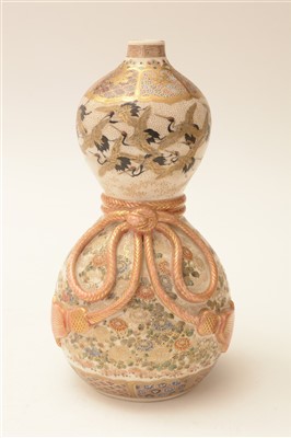 Lot 51 - A pair of 19th Century Japanese earthenware double gourd shaped wine bottles.