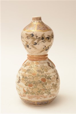 Lot 51 - A pair of 19th Century Japanese earthenware double gourd shaped wine bottles.