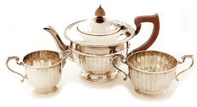 Lot 486 - Near matching three piece silver tea set