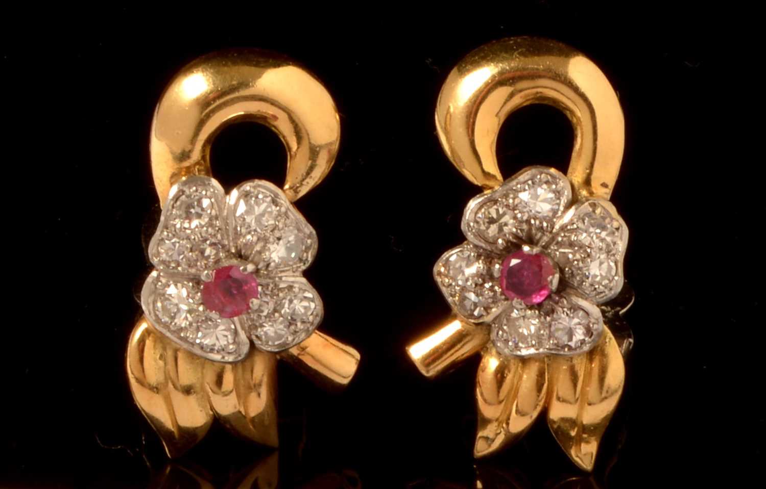 Lot 722 - A pair of ruby and diamond earrings