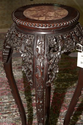 Lot 37 - A  carved Chinese hardwood jardiniere stand.