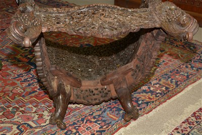 Lot 831 - An Anglo Indian carved hardwood armchair.