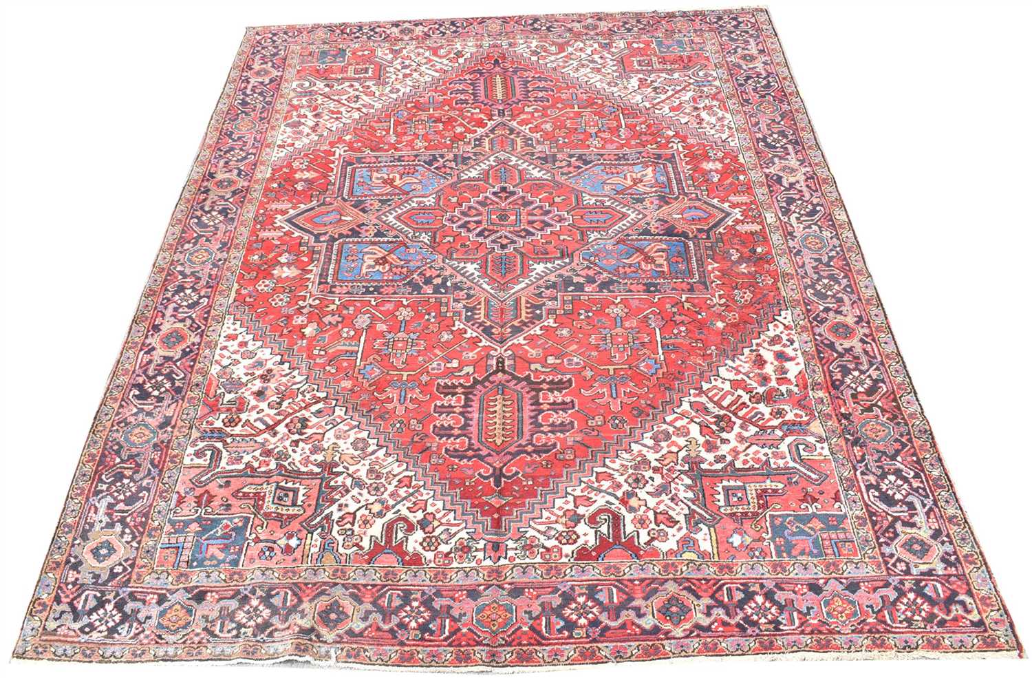 Lot 693 - Heriz carpet, with bold geometric design, 297...
