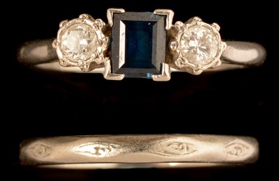 Lot 560 - Sapphire and diamond ring and a wedding band