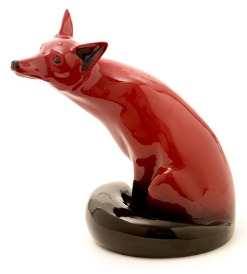Lot 126 - A Royal Doulton flambé large figure of a seated fox.