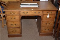 Lot 696 - An early 20th Century mahogany kneehole desk.