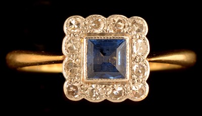 Lot 619 - Sapphire and diamond cluster ring