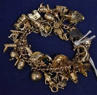 Lot 264 - Gold charm bracelet