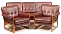 Lot 86 - A mid 20th Century teak and burgundy leatherette three-piece suite.