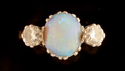 Lot 640 - Opal and diamond ring