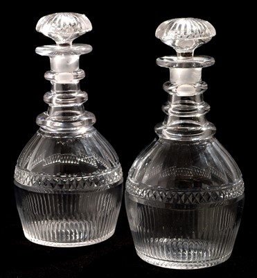 Lot 169 - A pair of 19th Century triple ring necked decanters.