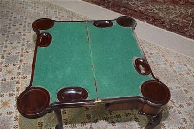 Lot 767 - A George III mahogany triple top tea and card table.