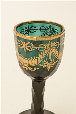 Lot 165 - A late 18th Century green faceted wine glass.