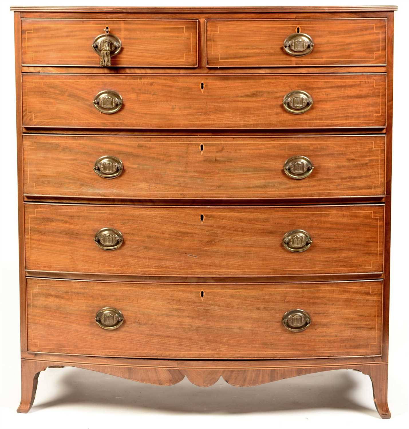 Lot 776 - A George III mahogany bowfront chest.