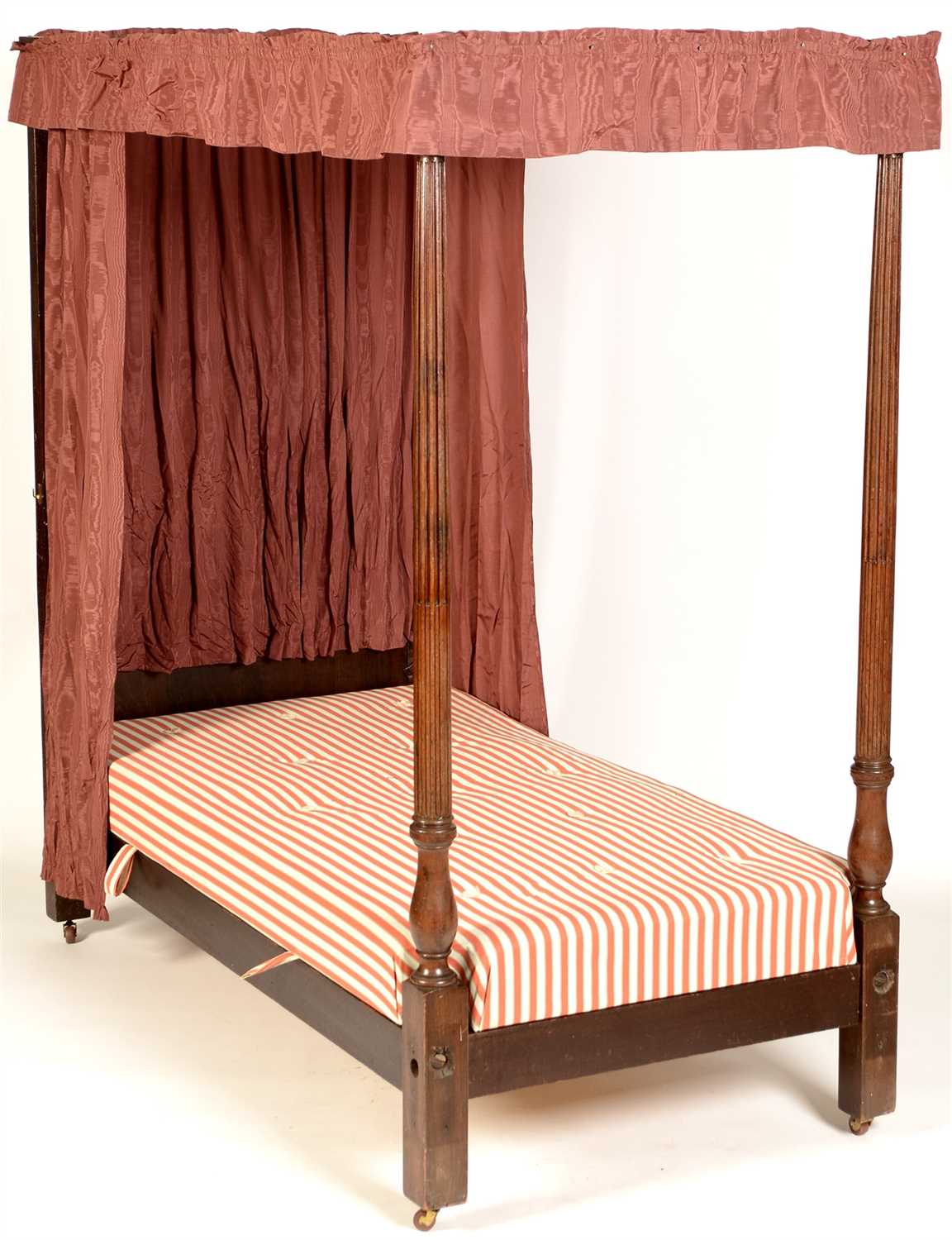 Lot 777 - A mahogany four-poster single bed.