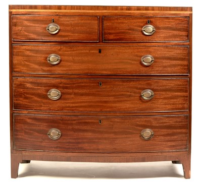Lot 779 - A George III bowfront mahogany chest.