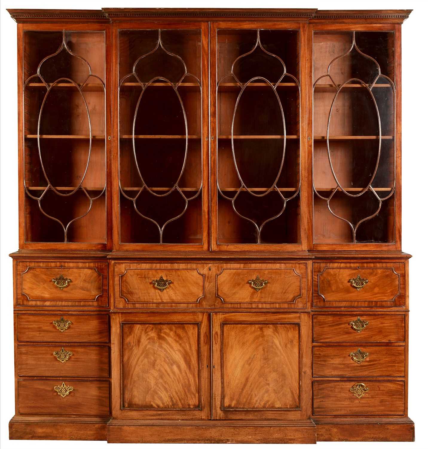 Lot 794 - A George III mahogany breakfront secretaire bookcase.