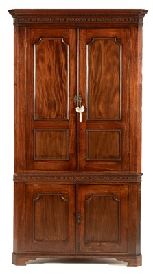 Lot 799 - A Georgian mahogany standing corner cupboard.