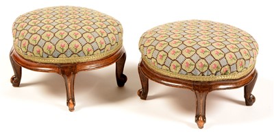 Lot 819 - A pair of Victorian walnut circular footstools.