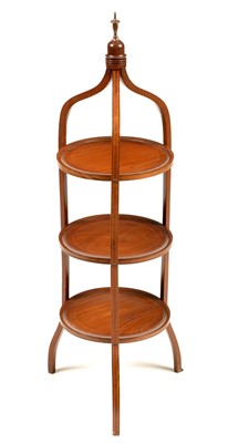 Lot 818 - An Edwardian mahogany and boxwood strung three-tier cake stand.