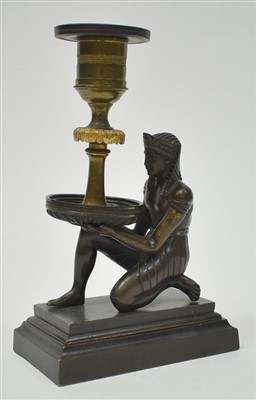 Lot 445 - Egyptian style bronze candlestick