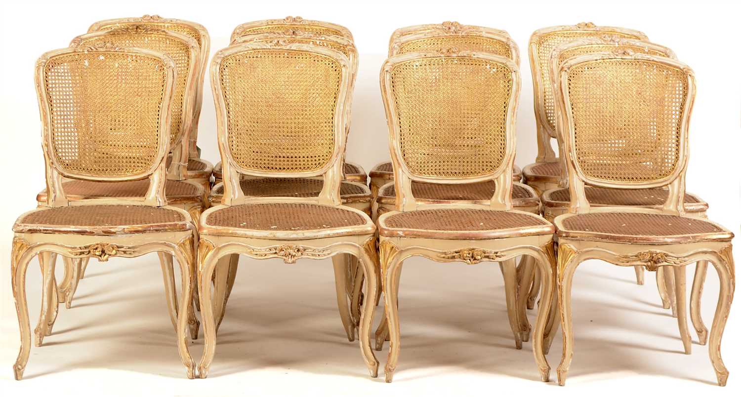 Lot 832 - A set of twelve George III parcel gilt side chairs in the Louis XV style.