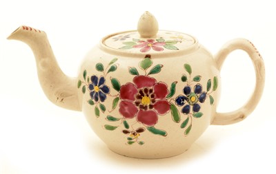 Lot 117 - A small mid 18th Century Staffordshire salt glazed teapot and cover.