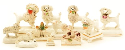Lot 91 - Eleven Staffordshire encrusted poodles and sheep.
