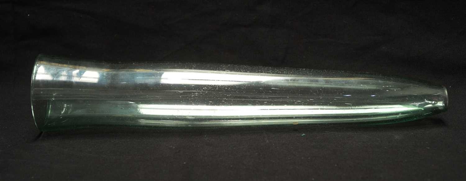 Lot 210 - A green tinted glass cucumber straightener.