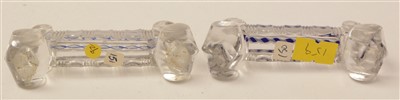 Lot 196 - A set of seven pressed and cut glass knife rests; and a set of eight table salts.