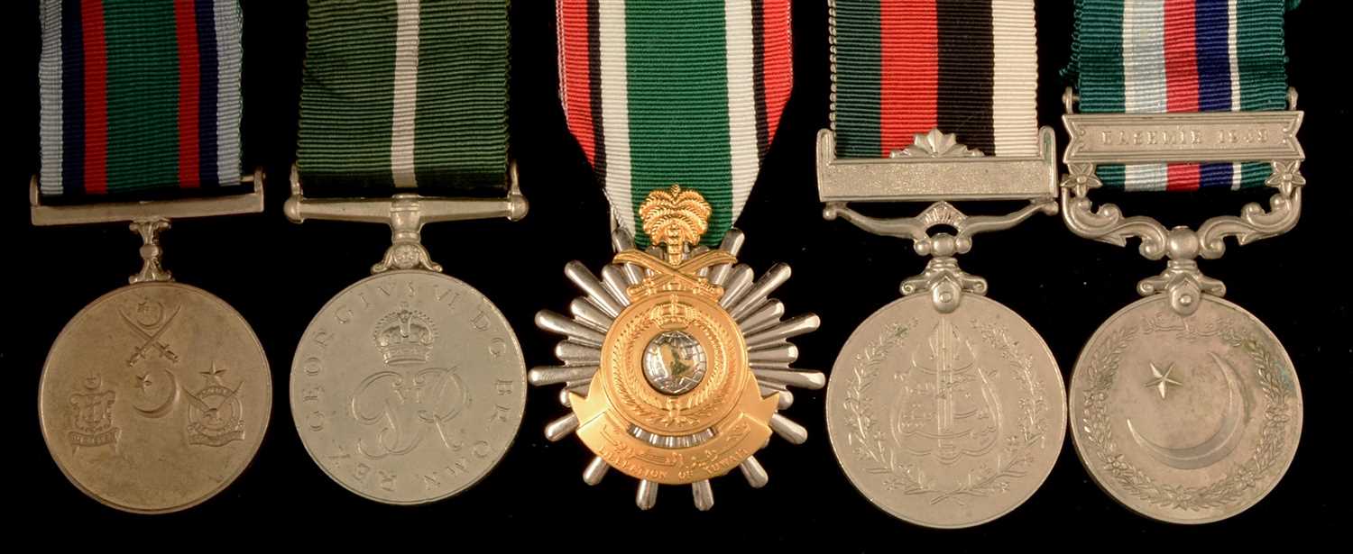 Lot 1851 - Four Pakistan medals and a Saudi Arabia medal