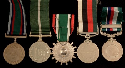 Lot 1851 - Four Pakistan medals and a Saudi Arabia medal
