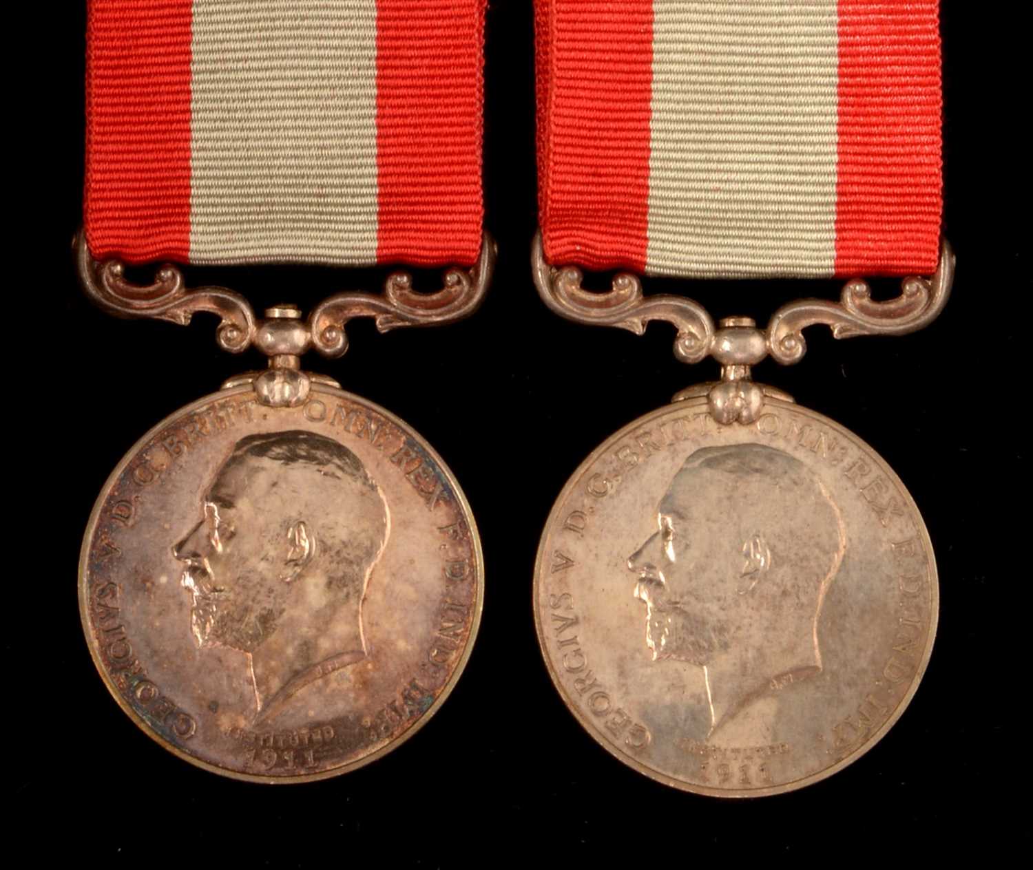 Lot 1771 - A pair of family Rocket Apparatus Volunteer Long Service medal