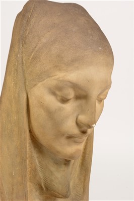 Lot 1631 - A 1960's clay ornament depicting the head of a woman.